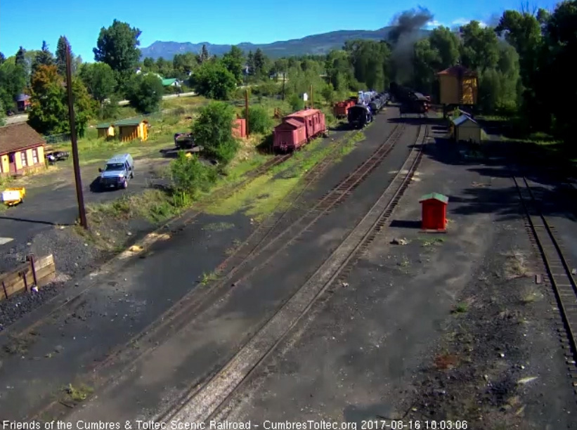 8-16-17 The locomotives are in the curve out of town as the parlor passes the water tank.jpg