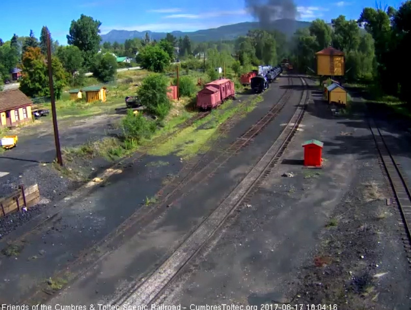 8-17-17 The last cars round the curve north of the yard as the speeder readys to follow.jpg