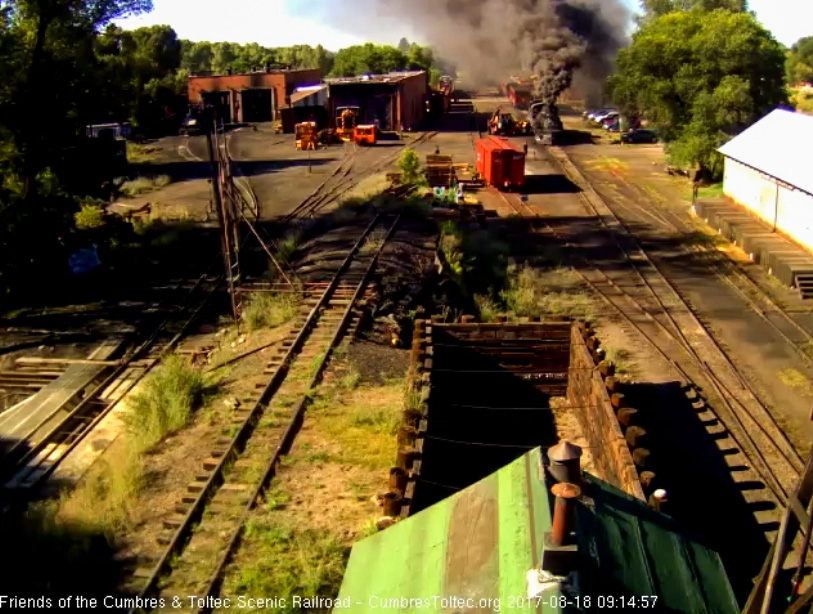 8-18-17 The 489 puts out some thick, black smoke as a loader has pulled up beside it.jpg