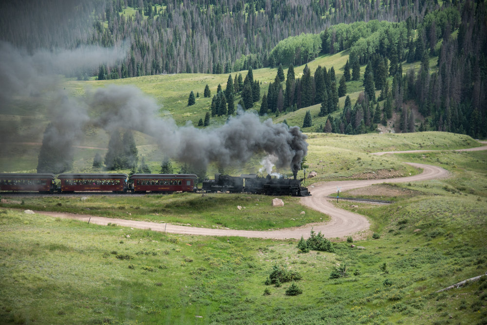 4 Blowing for an access road to the off grid homes, 487 contniues its climb.jpg