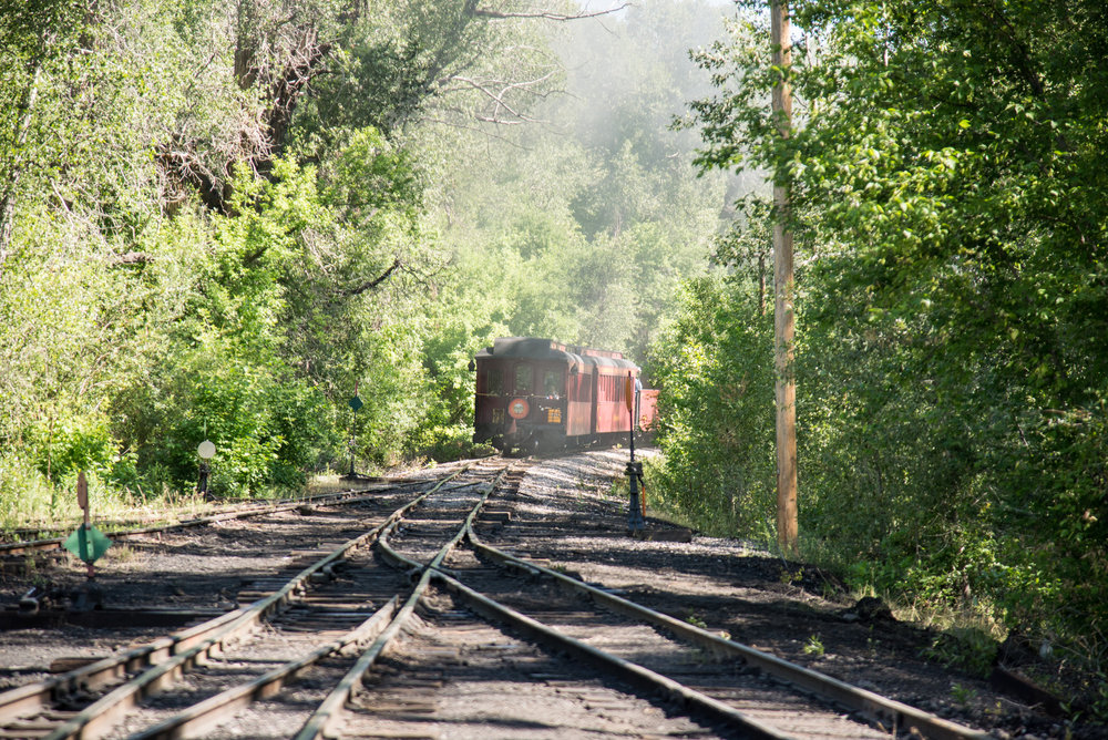 4 The tourest and parlor cars are getting ready to round the curve toward the Chama River bridge.jpg