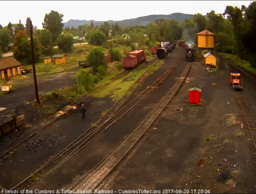 8-20-17 487 brings the 9 car train 215 into Chama 1.3 hours late as Frank walks down to greet the train.jpg