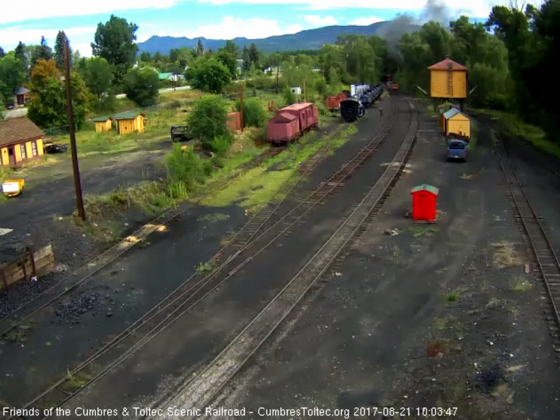 8-21-17 The last cars of the train are rounding the curve toward the bridge as the speeder follows.jpg