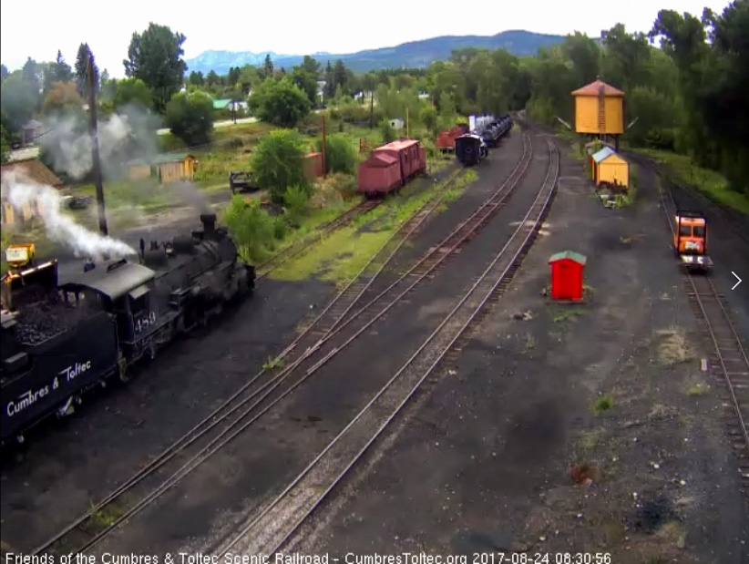 8-24-17 The loader dumps another bucket full into the bunker of 489's tender.jpg