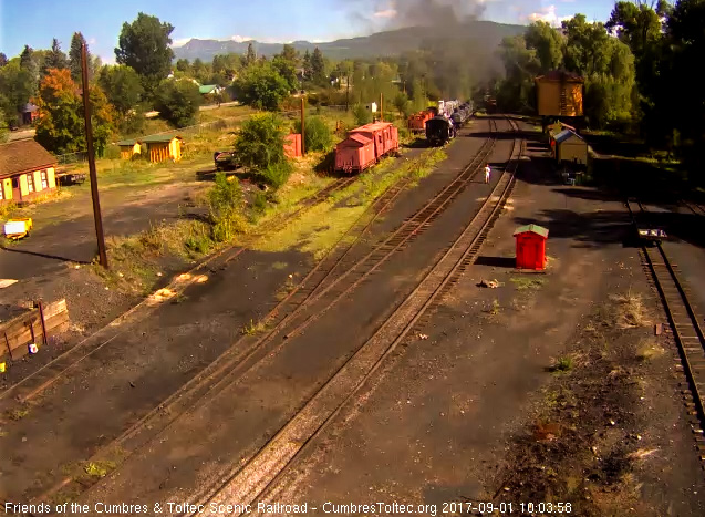 9-1-17 The speeder is on the main as the last cars of the train round the curve.jpg