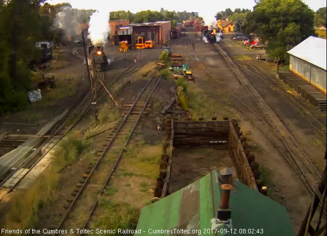 9-12-17 The 488 brings the student freight out onto the main as 489 leaves the house to start its day.jpg