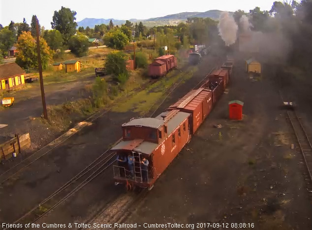 9-12-17 The conductor and several students are on the back platform of the caboose.jpg