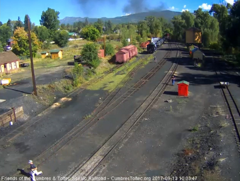 9-13-17 The last cars of train 216 round the curve north of the yard as we see a chaser running to his car.jpg