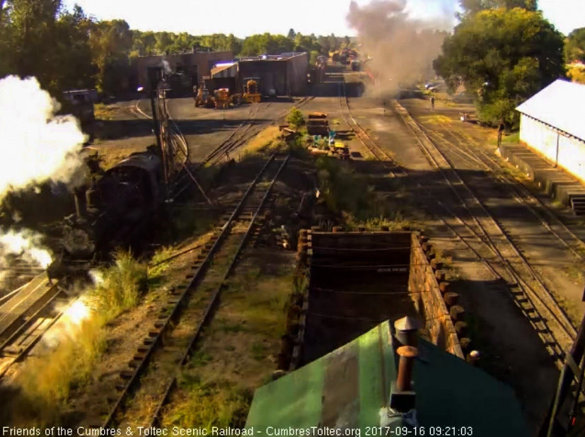 9-16-17 The 463 has finished its morning prep and is headed back to the house as 488, behind the veil of steam, has pulled the train into loading position.jpg