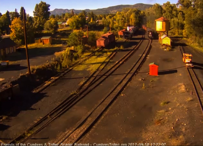 9-18-17 The setting sun catches the train as it passes the tank.jpg