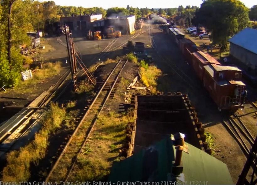 9-18-17 On the way to the wye, the caboose passes the wood shop.jpg