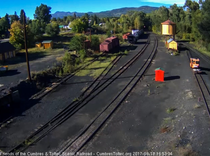 9-19-17 The headlight of 489 shines out of the trees at the north end of Chama yard.jpg