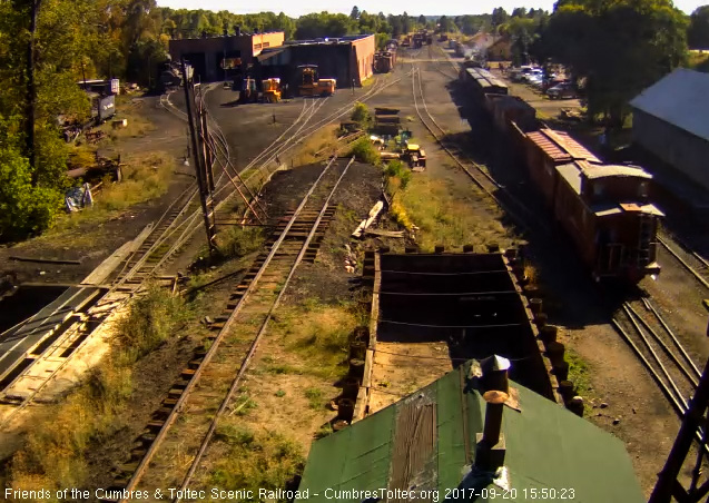 9-20-17 The train is passing the wood shop as it heads to the wye.jpg