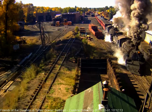 10-1-17 Lots of smoke and steam as the locomotives pass the wood shop.jpg