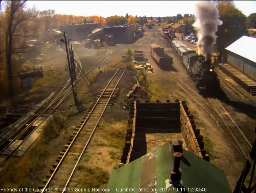 10-11-17  The freight passes the wood shop as it heads back out of Chama.jpg