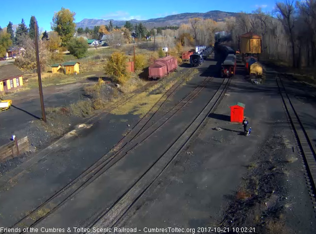 10-21-17 The locomotives of the long train are clear of the yard as the parlor passes the speeder sheds.jpg