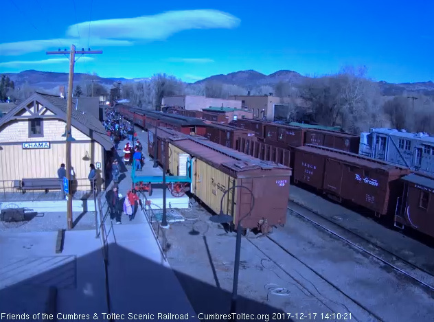 12-17-17 The passengers are wait to board train 4 as Mr and Mrs Claus are standing by the depot.jpg