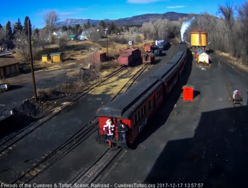 12-17-17 Train 3 shoves back into Chama with Santa, the conductor and one other on the platform.jpg