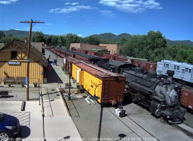 2018-06-08 The 484 is slowing for the stop with its 8 car train.jpg