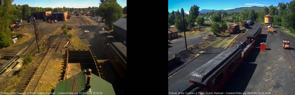 2018-06-10 The train comes by the tipple as a few people are in the open gon.jpg