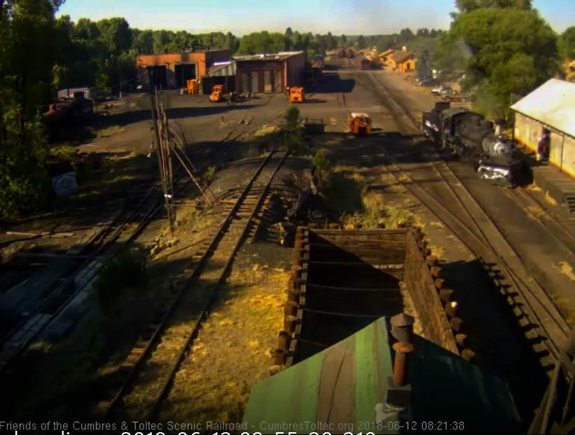 2018-06-12 The 487 pulls past the woodshop as it heads to get coal.jpg