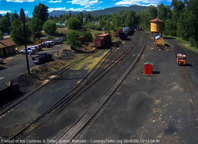 2018-06-17 Several mule deer cross the yard by the tank.jpg