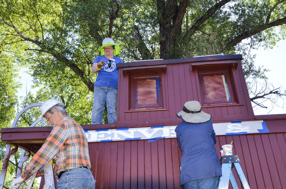 2018-06-20 The stencil crew at work on a caboose.jpg