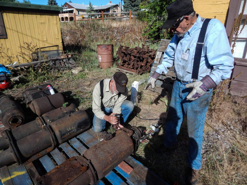2018-06-20 The air brake crew checks out some spare brake cylinders.jpg