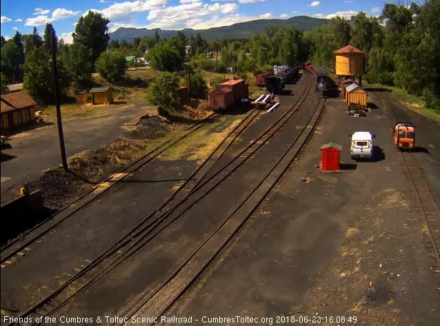 2018-06-23 The 487 comes by the tank as the last cars enter the yard.jpg