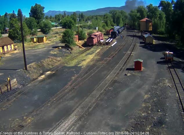 2018-06-24 The last cars of train 216 round the curve and head east.jpg