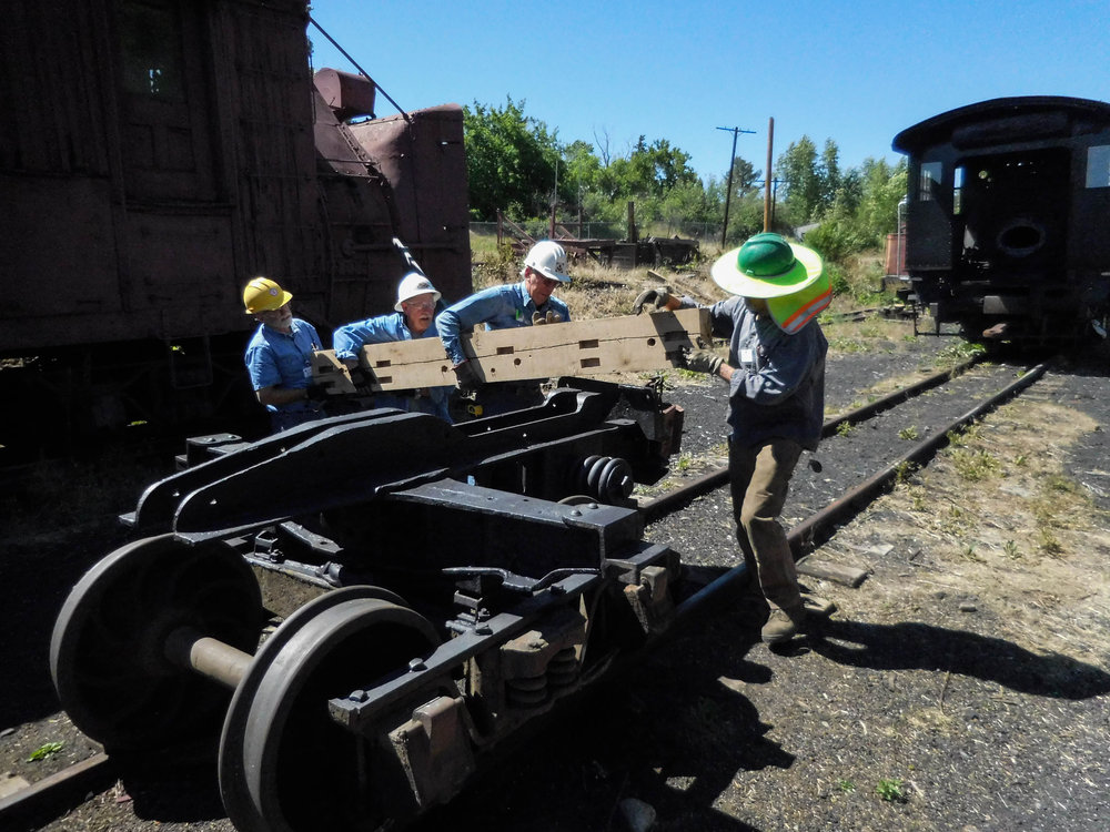 2018-06-21 The crew working on the rider gon works on one of the trucks.jpg