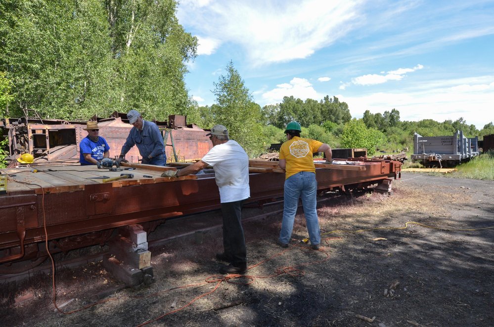 2018-06-28 The crew in the swamp works on the flat car rebuild.jpg