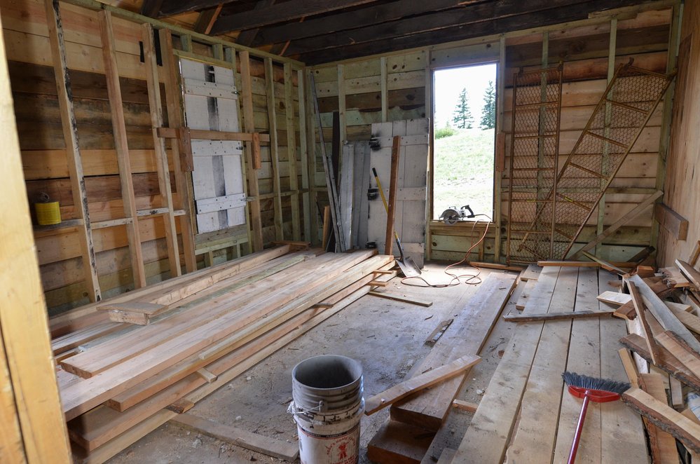 2018-06-27 Boards piled everywhere as work progresses in the interior of the car inspector's house.jpg