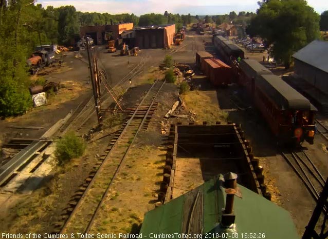 2018-07-08 The parlor is passing the woodshop as the trainman is watching from the steps.jpg