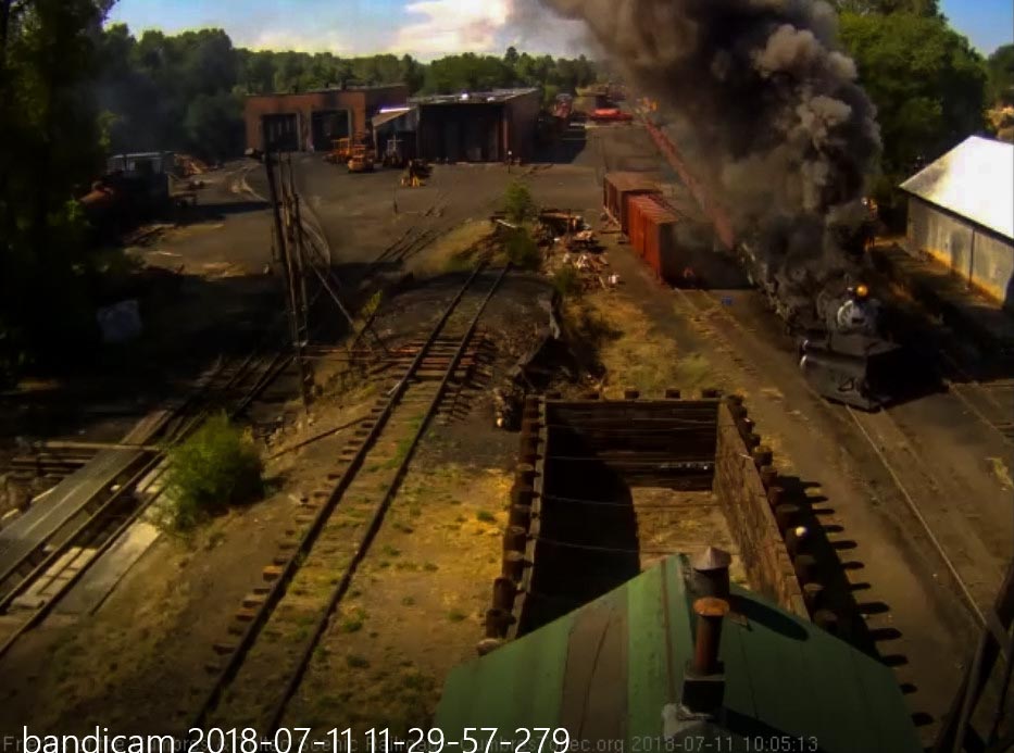 2018-07-11 The 487 is putting out a nice smoke plume as it passes the woodshop.jpg