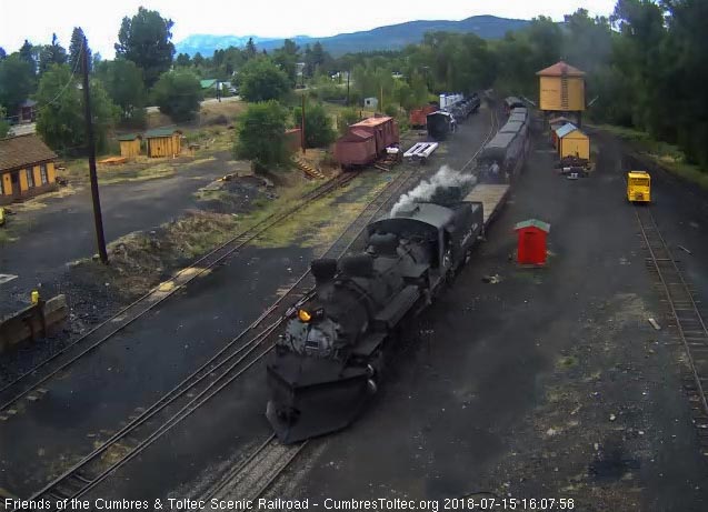 2018-07-18 As the train approaches the tipple, we see a normal 7 car train with a flat car up front.jpg