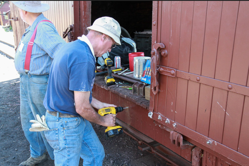 2018-07-24 Having marked the location they now drill the holes.jpg