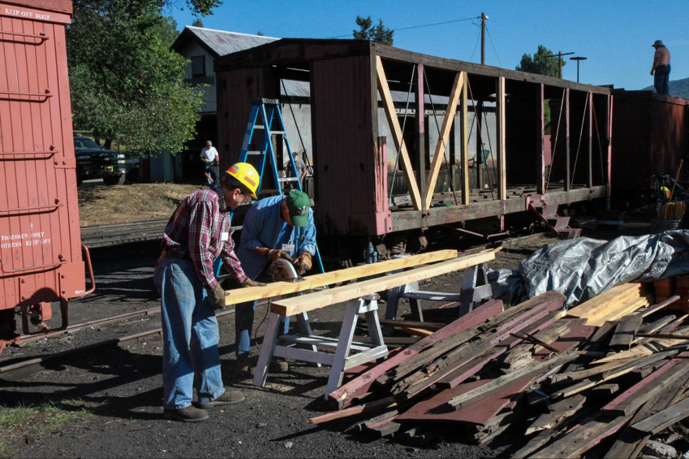 2018-07-24 The crew working on converting P-Box 213 to box car 3476 cut some wood for it (2).jpg