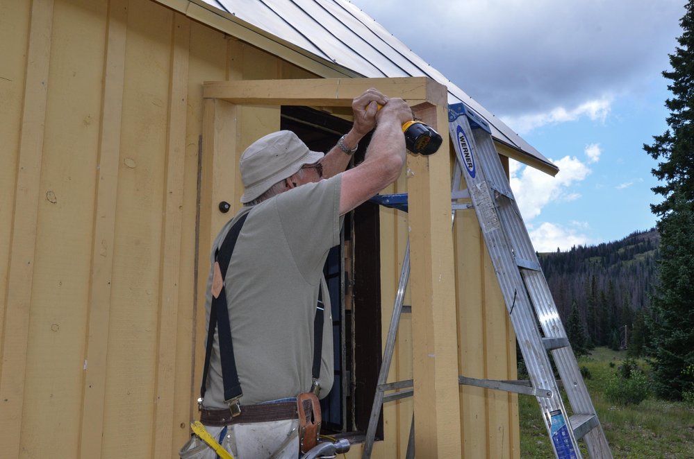 2018-07-26 Putting the porch roof on the car inspectors hose at Cumbres.jpg