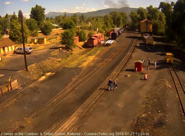 2018-07-27 The people are walking back as the last cars round the curve.jpg
