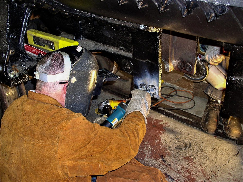 2018-07-27 Welding on the tank car frame as the grinding goes on_.jpg