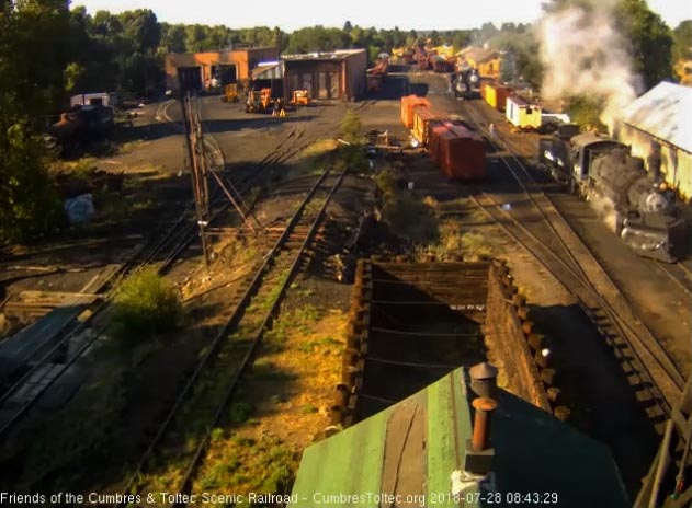 2018-07-28 The 487 is passing the woodshop as it heads to the coal dock while 463 is waiting on the road crew.jpg