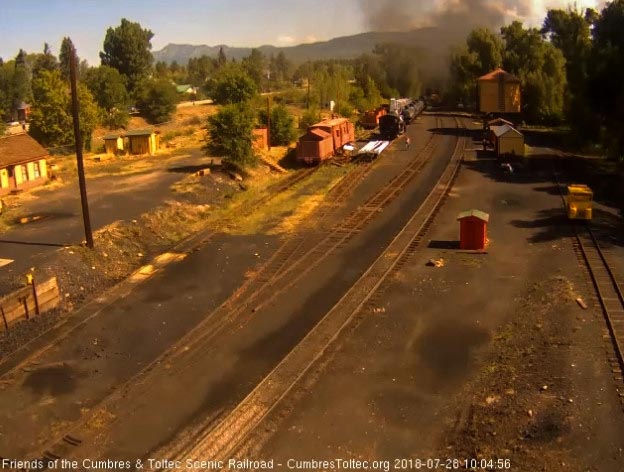 2018-07-28 The last cars round the curve under a hanging cloud of smoke.jpg