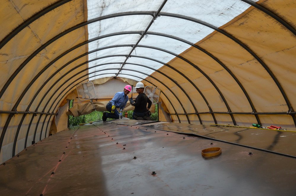 2018-07-28 A couple of happy Friends working on the metal roof of the sheep car.jpg