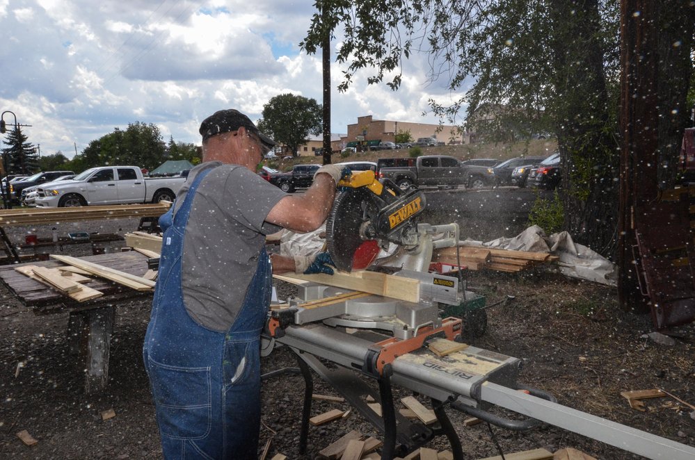2018-07-28 The wood chips fly as he cuts another side slat for the paint car.jpg