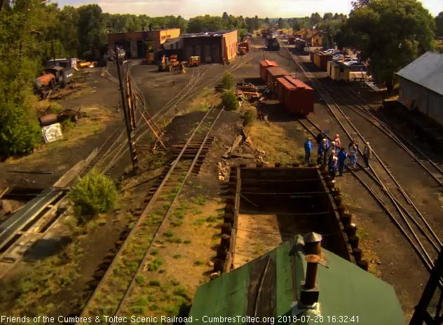 2018-07-28 Must be a tour group as they are getting a guided tour of the yard from the guy is navy.jpg