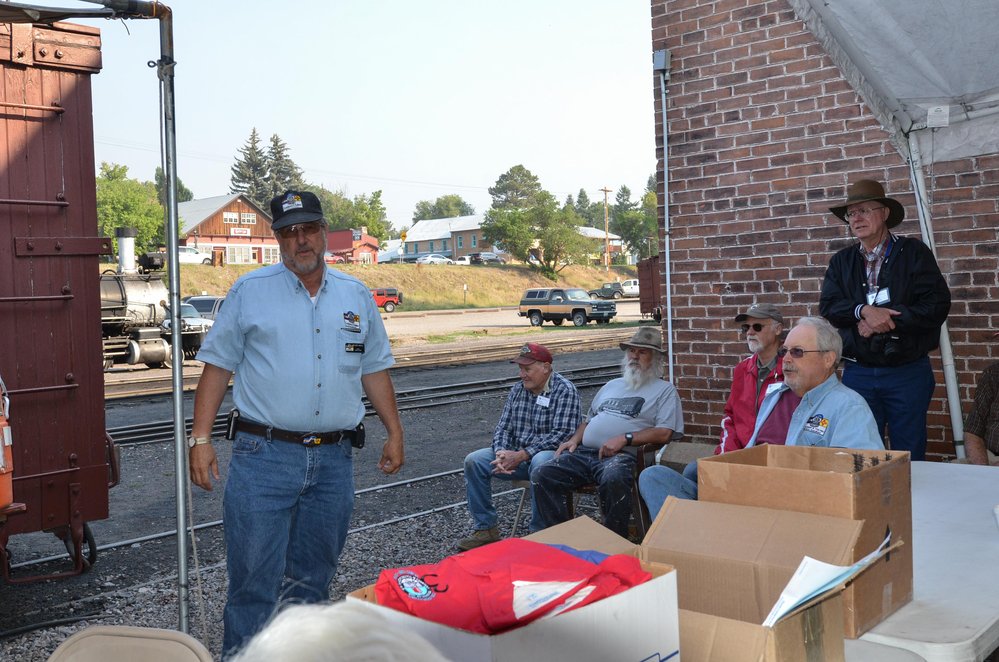 2018-07-30 Wade Hall gives the railroad safety briefing to the gathered workers.jpg
