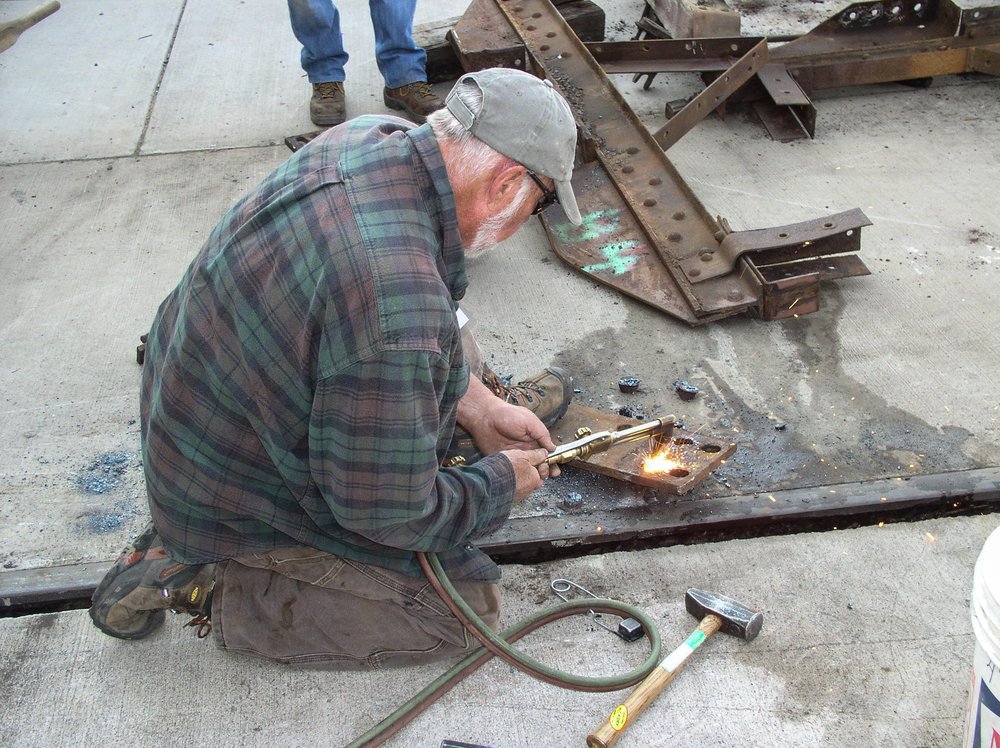 2018-08-01 Using the torch to cut out the old bolts.jpg