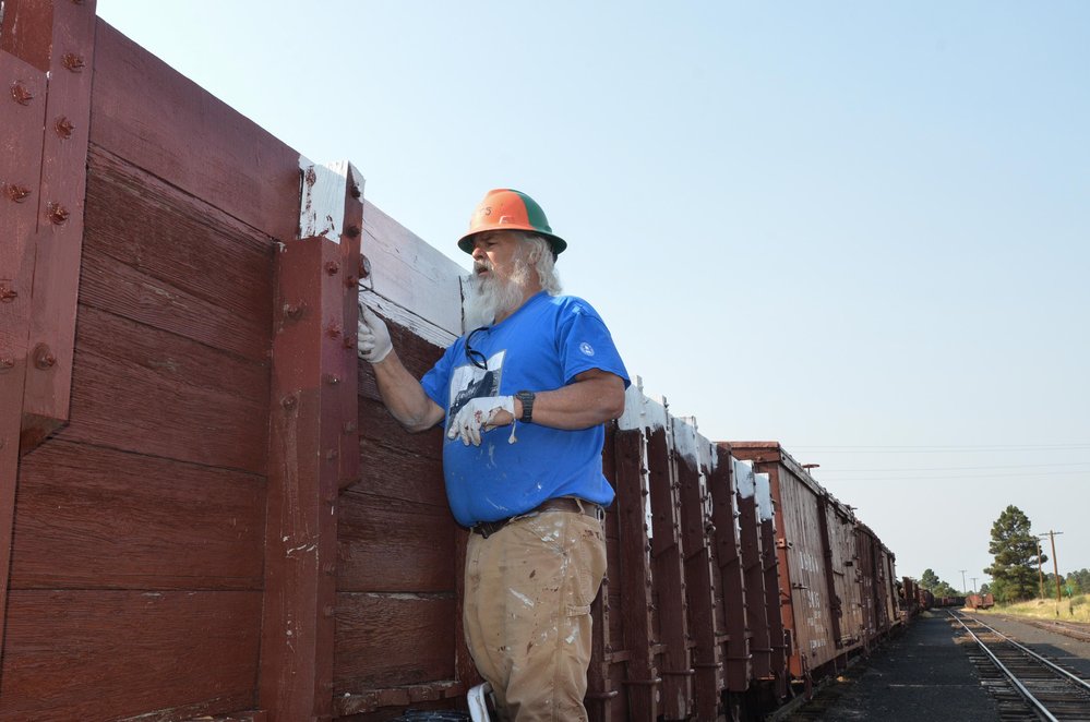 2018-08-01 Brad is priming one of the high sided gons in the yard.jpg