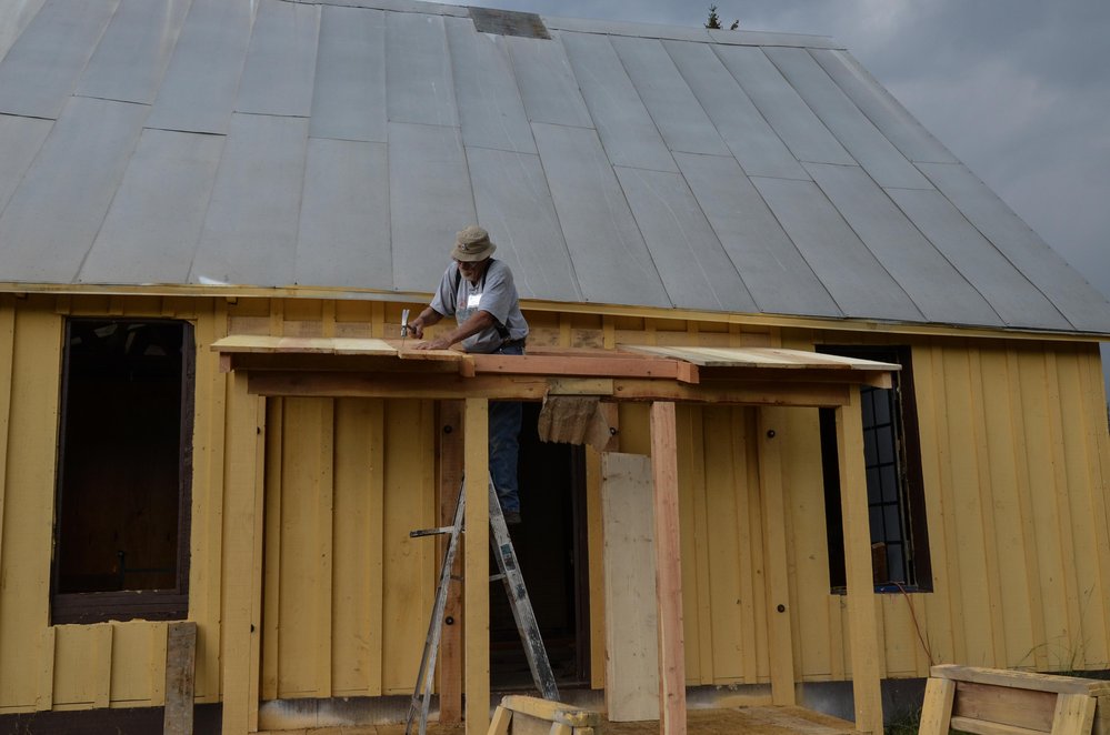 2018-08-01 The porch roof at the car inspectors house is coming right along.jpg